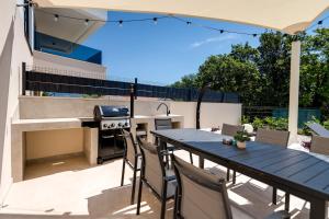 Villa Mirakul, new modern villa with swimming pool, close to the beach, children playroom, quiet area- by TRAVELER tourist agency Krk - ID 2680