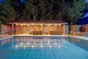 Peaceful 5 BHK Farmhouse With Private Pool, Gazebo & Lush Garden