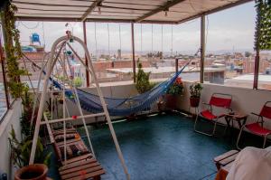 Hab baño compartido, 10 cdas Plaza de Armas, con terraza y vista a los volcanes