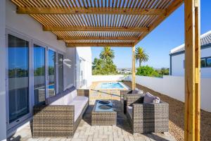 Sunlit Oasis Ocean & Golf Retreat by Host Agents