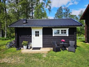 Mysig timmerstuga på dalagård