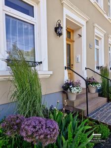 Komfort Ferienwohnungen mit Wellness-Garten - Gästehaus am Bachlauf - Losheim am See