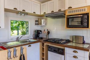 Campings Beau mobile home avec terrasse : photos des chambres