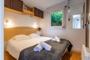 Campings Beau mobile home avec terrasse : photos des chambres