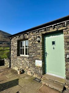 Oak Tree Cottage nestled in the hills of the Lake District and Yorkshire Dales