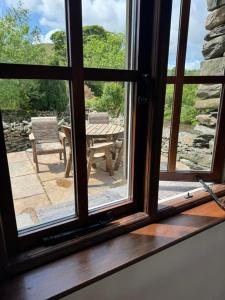 Oak Tree Cottage nestled in the hills of the Lake District and Yorkshire Dales