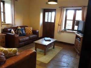 Oak Tree Cottage nestled in the hills of the Lake District and Yorkshire Dales