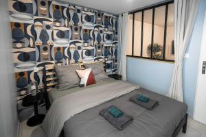 Appartements L-Esprit d-Herbin - Un Sejour Abstrait en liaison a Blois : photos des chambres