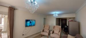 Fully finished 3-bedroom, 3-bathroom apartment with garden view in Jana Compound, Sheikh Zayed near Hyperone