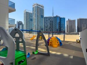 Modern 2BR with Private Terrace, Pool and Gym Access