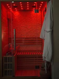 Appartements Le Jacaranda - Suite africaine - Sauna & Netflix : photos des chambres
