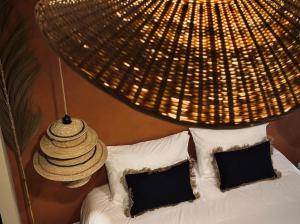Appartements Le Jacaranda - Suite africaine - Sauna & Netflix : photos des chambres
