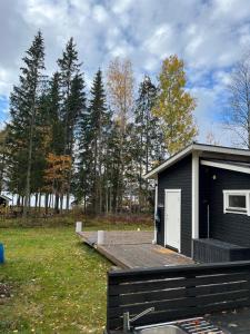 A simple stuga on a lake incinerating toilet in a separate building next to the cabin Water for drinking and washing hands dishes comes from two containers that attach to a faucet through a simple electric pump OBS no shower on site