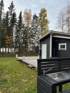 A simple stuga on a lake incinerating toilet in a separate building next to the cabin Water for drinking and washing hands dishes comes from two containers that attach to a faucet through a simple electric pump OBS no shower on site