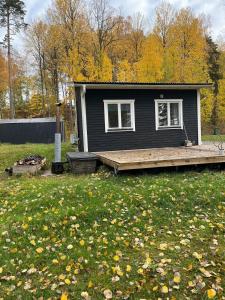 A simple stuga on a lake incinerating toilet in a separate building next to the cabin Water for drinking and washing hands dishes comes from two containers that attach to a faucet through a simple electric pump OBS no shower on site