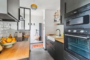 Appartements Duplex design relaxing garden Porte de Paris : photos des chambres