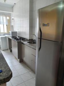 Apto com cozinha e lavanderia