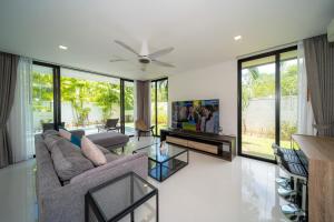Modern minimalist style luxury villa with private pool located in a high-end resort area adjacent to Laguna Park Golf Course