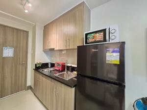 1BR Condotel with Balcony at FAME Residences #FM63-1