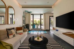 SaffronStays Rio - 4BR pet-friendly villa with glass-bottom pool, rooftop party zone & bar near Candolim & Coco Beach