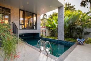 SaffronStays Rio - 4BR pet-friendly villa with glass-bottom pool, rooftop party zone & bar near Candolim & Coco Beach