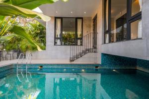SaffronStays Rio - 4BR pet-friendly villa with glass-bottom pool, rooftop party zone & bar near Candolim & Coco Beach