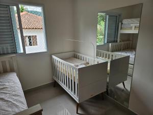 Casa em Boiçucanga com 2 suítes, piscina e sauna integrada