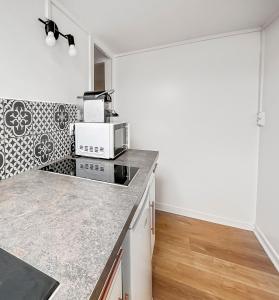 Appartements Charmant studio - vue parc- proche transports : photos des chambres