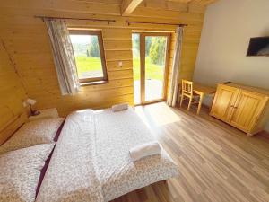 Chata Wilka - całoroczny dom z bali na wyłączność z 3 sypialniami