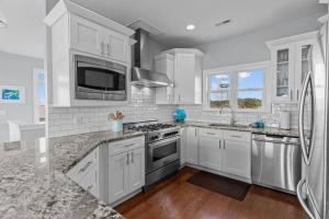 Ocean View Pool Waterslide Elevator & Firepit