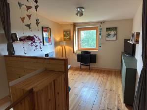 Maisons de vacances Maison en bois a la campagne proche vilaine : photos des chambres