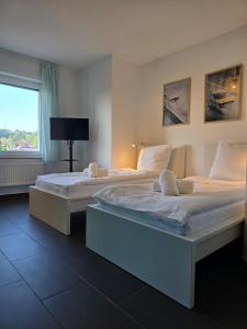 APARTMENT PD23 ALTE FEUERWACHE I Ganze Wohnung I 5 Einzelbetten I 3 Zimmer I 3min CityHospital I 50m Supermarkt I Küche I SmartTV