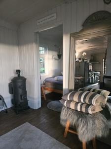 Autentieke pipowagen Bijzonder Buitenaf met jacuzzi en Finse sauna