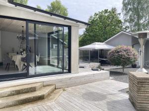 Modern Cottage with Deck in Sandskogen