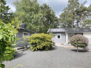 Modern Cottage with Deck in Sandskogen