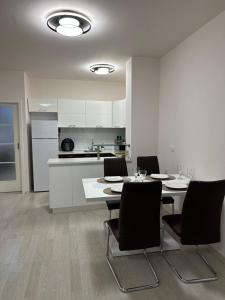 Apartment Garden - two large terraces with hanging chairs and sunset view