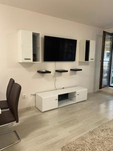 Apartment Garden - two large terraces with hanging chairs and sunset view