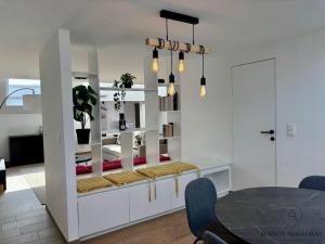 Le contemporain - Plein centre, place du Marché