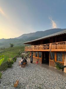 Traditional Hmong House Among Rice Fields