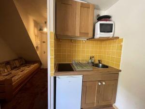 Résidence Pluton - Studio en plein cœur de station, face aux pistes avec place de parking privée et couverte MAE-5261