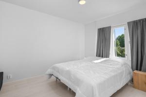 Kaupunkikolmio saunalla ja parvekkeella