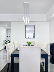 The comfort executive loft three bedroom apartment with amazing breathtaking city views ,heated swimming pool ,gym and rooftop chilly spot with offers breathtaking city views ,private ample parking space with designated child playground area