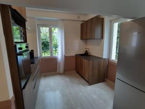 Appartements Grand Appartement avec Jardin Bretenoux : photos des chambres