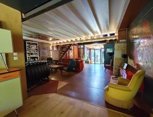 Maisons de vacances Maison d-artiste atypique en bordure de foret : photos des chambres