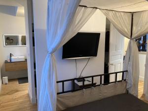 Maisons de vacances Propriete de coeur de ville avec piscine et jardin partages : photos des chambres