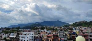 One room with two single beds with natural views