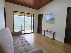 VILLA SANTA LUCÍA in front of the waterfall with a mountain view