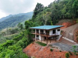 VILLA SANTA LUCÍA in front of the waterfall with a mountain view