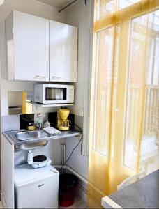 Appartements La ContrEscarpe - Studios fonctionnels - Secteur GARE CENTRE : photos des chambres