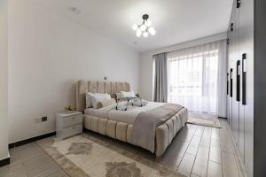 modern executive three bedroom apartment which features a swimming pool, state of the art fully equipped gym andmodern unmatched luxurious facilities which offfers luxury and comfort